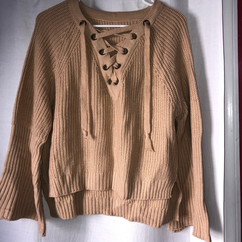 beige sweater with tie up detail size S